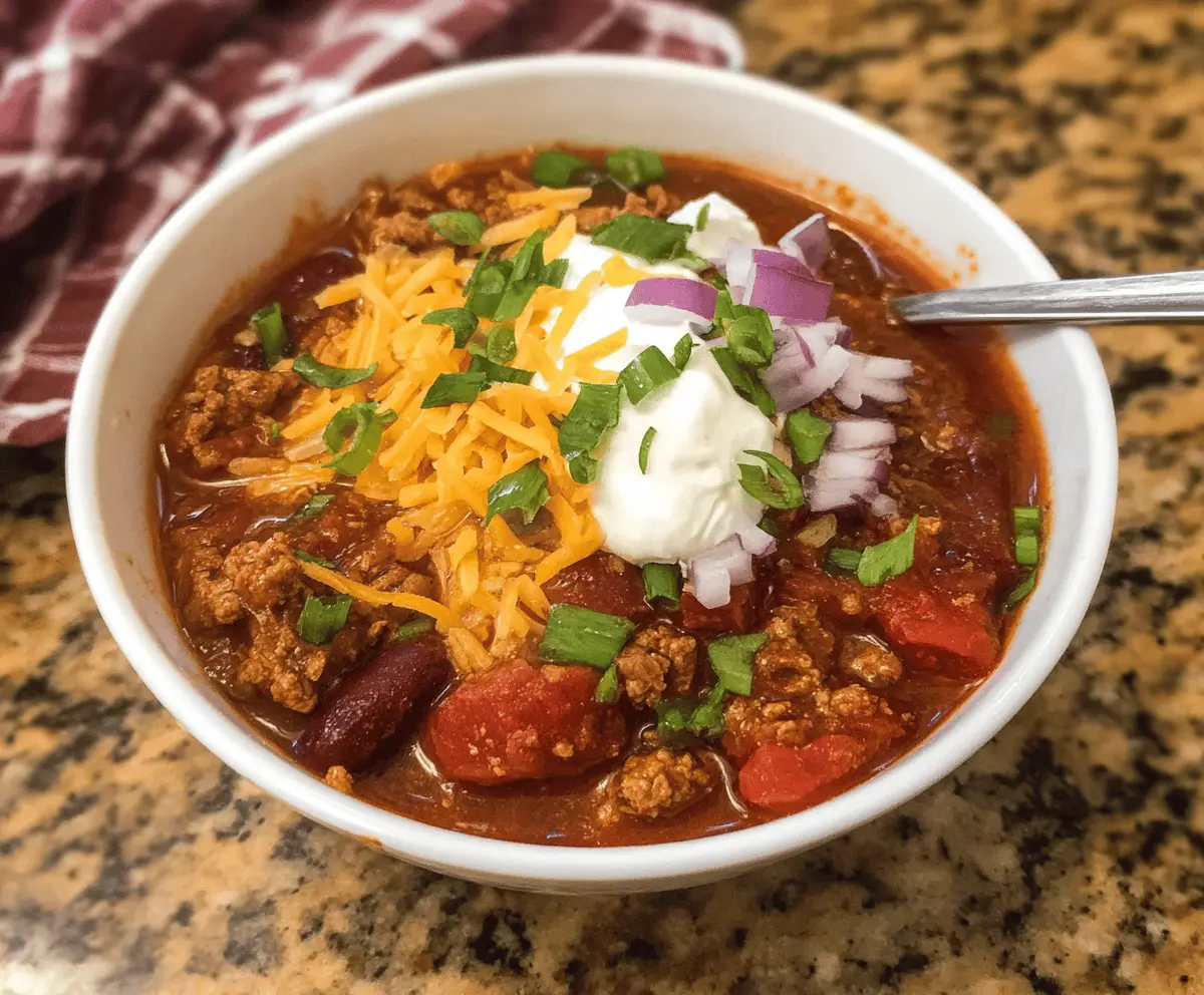 Delicious homemade Crockpot Chili with beans, ground beef, and spices in a slow cooker, perfect for a hearty meal