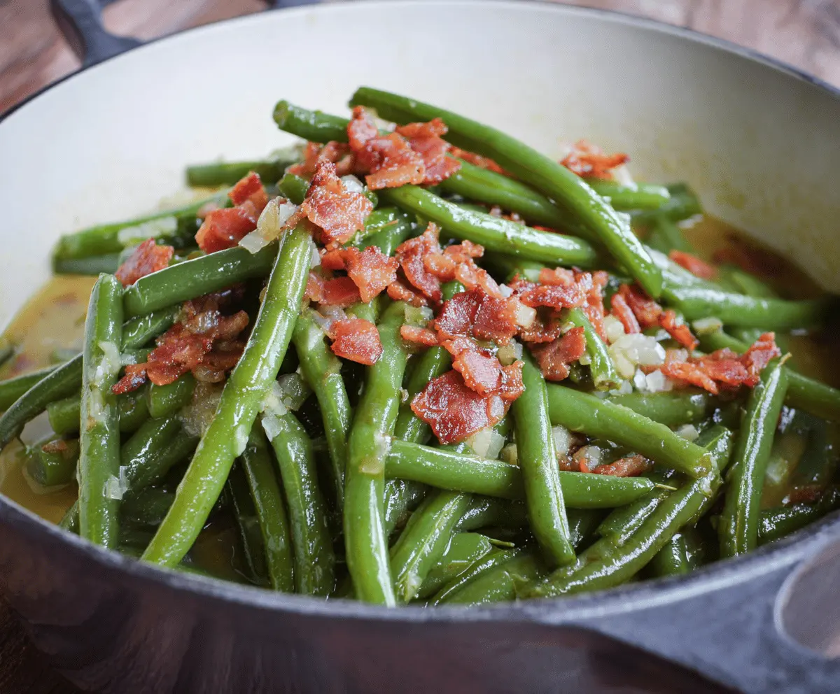 Delicious Southern Style Green Beans cooked with bacon and seasonings, served as a flavorful side dish.