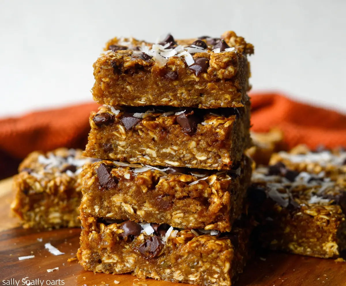 Delicious homemade pumpkin oatmeal bars with a crunchy topping and soft center, perfect for fall snacks.