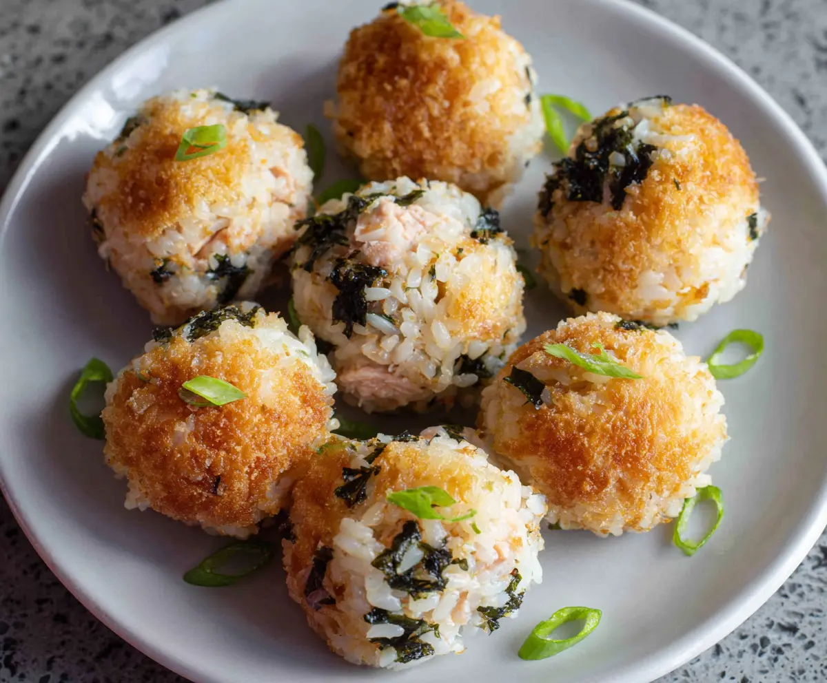 Delicious Tuna Rice Balls, Japanese-style sushi rice snacks with tuna filling and seaweed wrap.