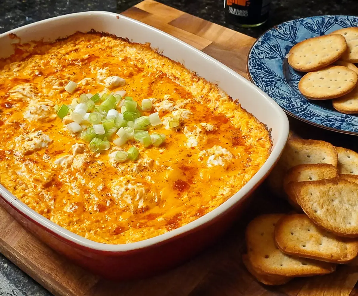 Creamy Frank's Red Hot Buffalo Chicken Dip served with fresh vegetables and tortilla chips.
