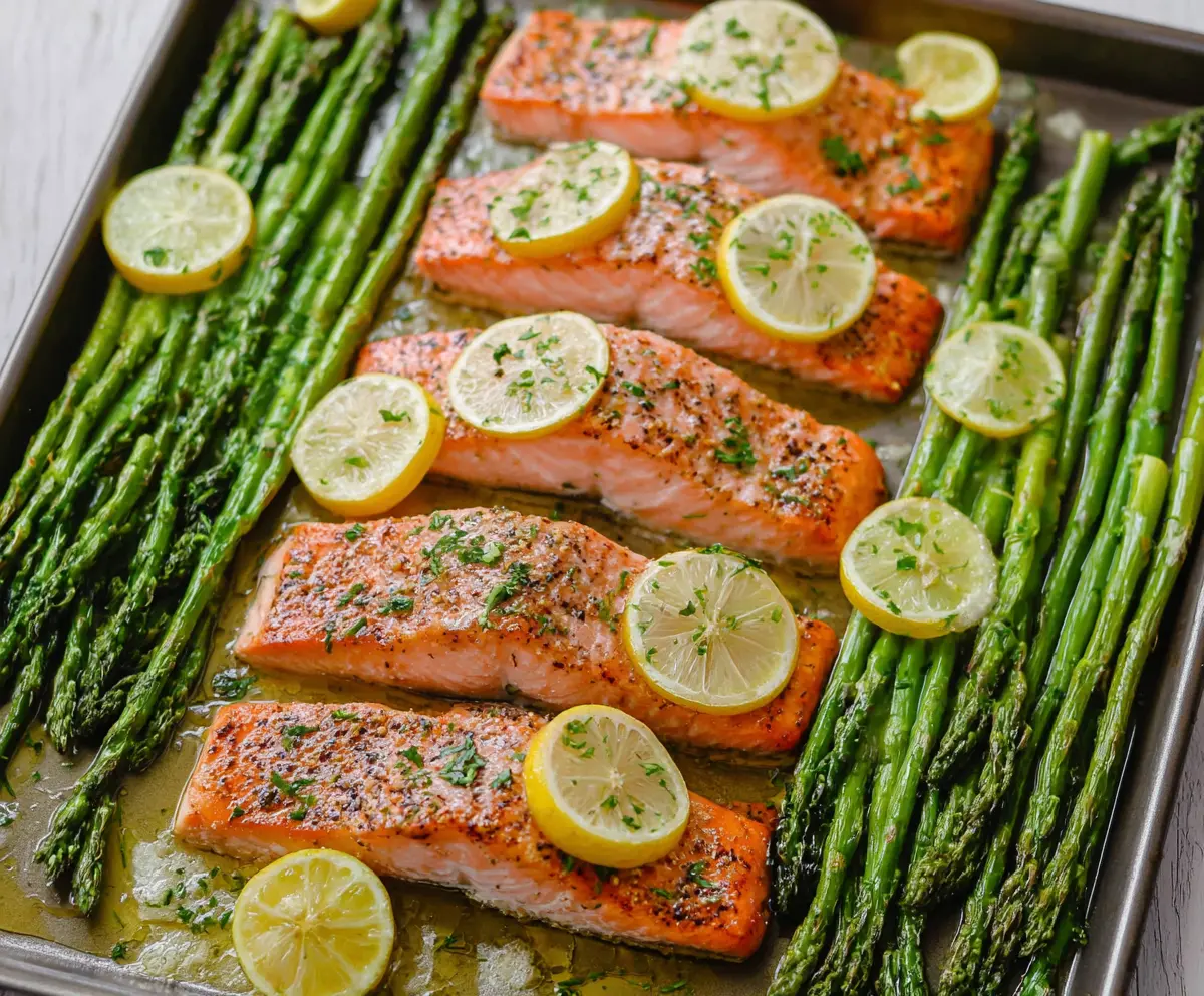 Delicious salmon and asparagus sheet pan dinner on a plate, perfect for a healthy meal.